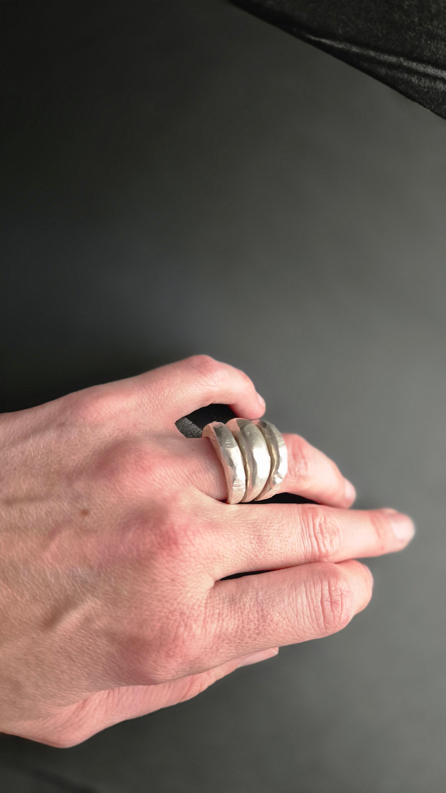 Hand-carved silver ring with hammered and cut texture