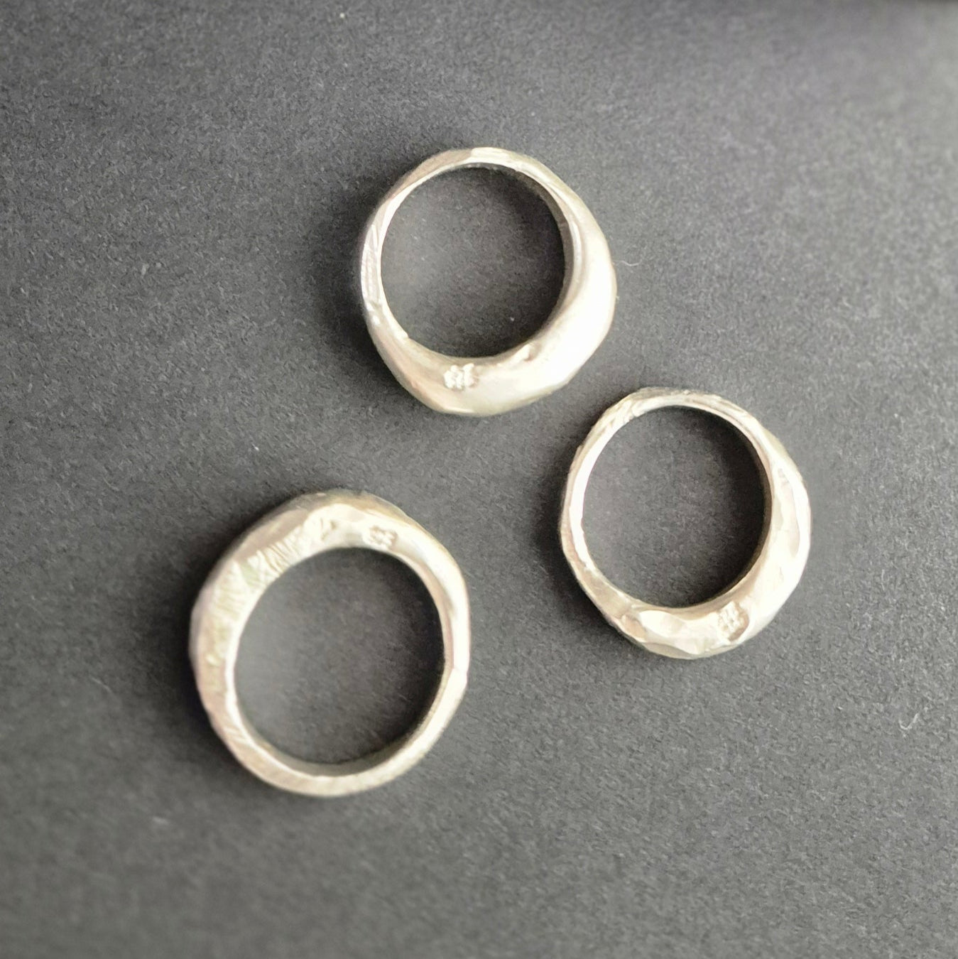 Hand-carved silver ring with hammered and cut texture