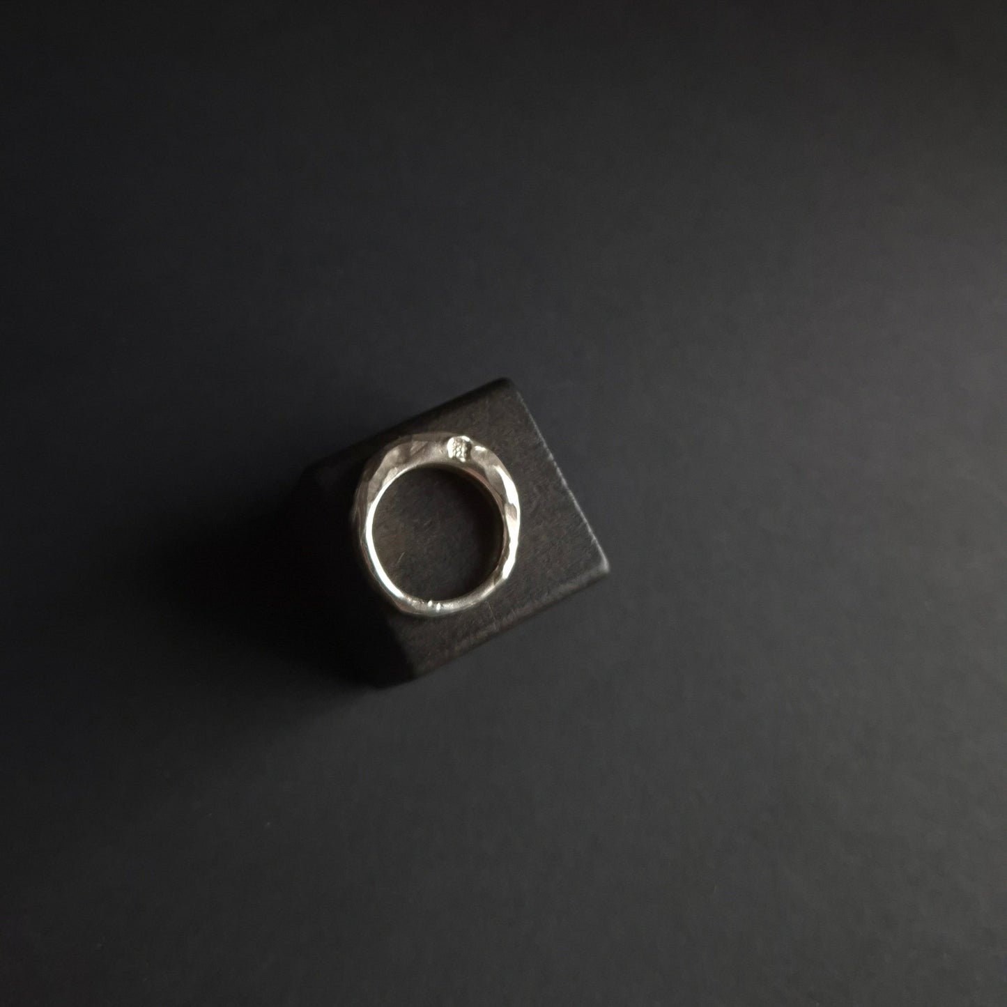 Hand-carved silver ring with hammered and cut texture