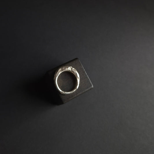 Hand-carved silver ring with hammered and cut texture